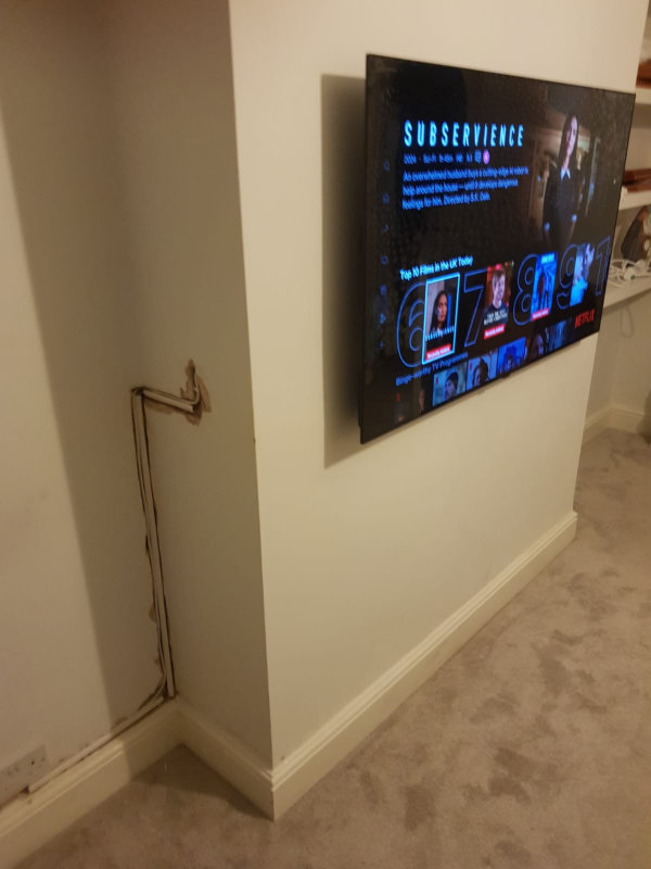 Mounting a TV to a wall and concealing the wires.